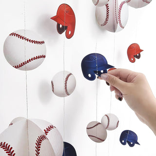 Baseball garland close-up: hanging baseball ornaments and red/blue bird toppers on strings