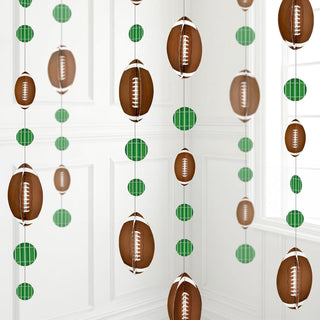 3D football party garland with brown football ornaments and green plaid circle loops