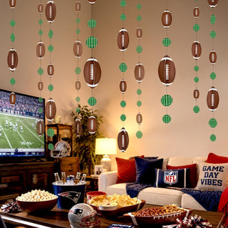 Game day football garland with hanging brown footballs and green plaid circle accents
