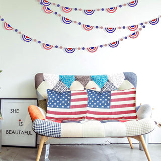 Red, white and blue semicircle banner garland draped above sofa cushions