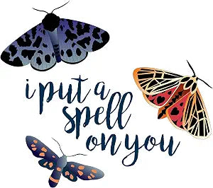 Wall sticker of blue moth, orange moth, butterfly, and 'put a spell on you'.