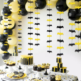 Black and yellow bat wall decorations with hanging bat cutouts