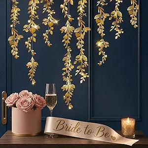 Gold leaf vine garland strands with decorative hanging leaves, set of 24 pieces.
