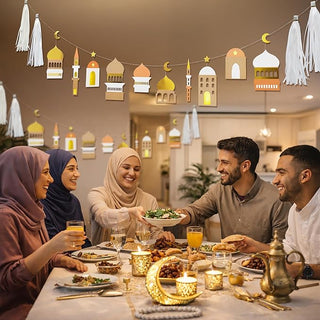 Ramadan garland with gold and white mosque decorations and white tassels above dinner
