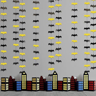 Sheet of black and yellow bat cutout decorations arranged in rows