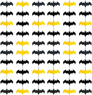 Rows of black and yellow bat hanging decorations on a grid