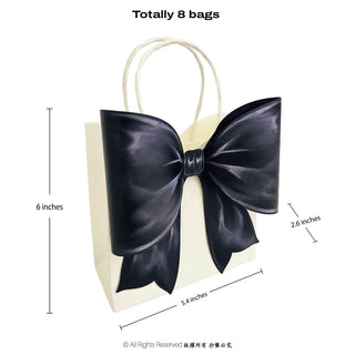 Cream gift bag with oversized dark satin bow and white rope handle