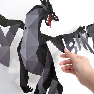 Black dragon banner close-up with geometric dragon and HAPPY BIRTHDAY letters