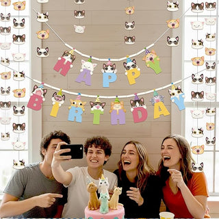 Cat themed birthday banner with letter flags spelling HAPPY and BIRTHDAY at party