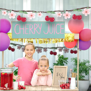 Cherry-themed party banner garland with red cherries, pink flowers, and green leaf accents