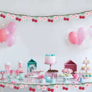 Cherry flower banner garland with red cherries, pink blossoms, and green vine leaves