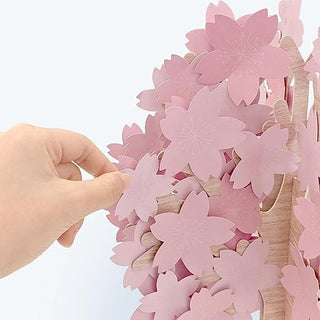 Cherry blossom tree centerpiece close-up of pink flower petals on wooden trunk