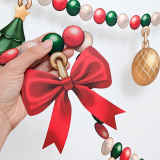 Christmas bead garland close-up with red bow and multicolor bead strands