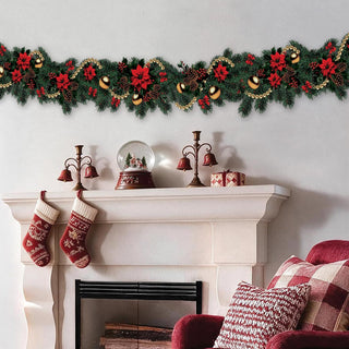 Christmas garland with pine leaves, red poinsettias, and gold ornaments for mantel decor