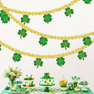 Gold coin paper garland with green shamrock cutouts hanging overhead