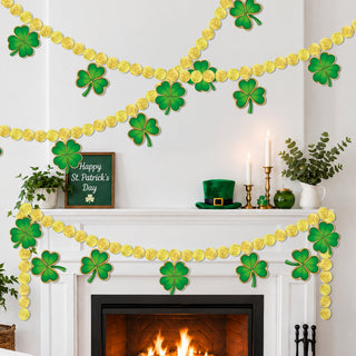 Gold coin paper garland with green clover cutouts along a fireplace mantel