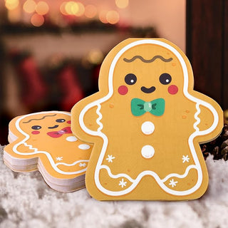 Gingerbread paper napkin stack with smiling cookie face and green bow tie