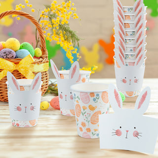 Easter cup sleeves set with white cups, pink rabbit ears, and floral egg patterns