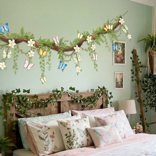 Floral butterfly wall banner with green vine garland, white blossoms, and colorful butterflies