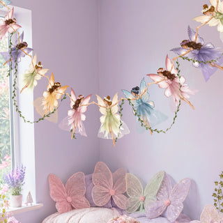 Pastel fairy and butterfly garland banner with leafy vine and floral fairy cutouts