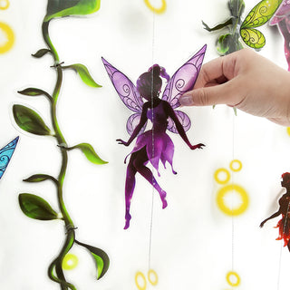 Purple fairy ornament on hanging strand with green leaf vines