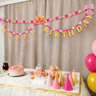 Happy Birthday banner with crown and pink heart bead garland, gold letter flags