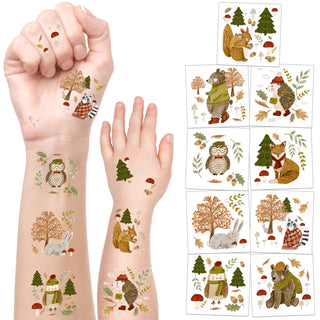 Temporary forest animal tattoos on forearms: owl, fox, pine trees, mushrooms