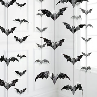 Geometric glitter bat garland with assorted black bat shapes on vertical strings