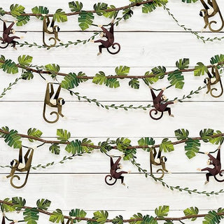 Jungle leaf garland with hanging monkey cutouts and scroll hooks, safari party decor
