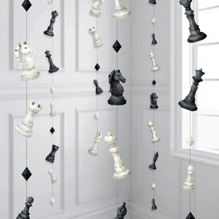 Chess garland with hanging black and white chess pieces and diamond accents