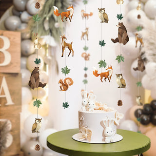 Woodland animal garland hanging with geometric animals, pinecones and leaf decorations