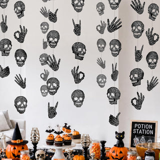 Black glitter skull and hand garland with repeating Halloween decoration motifs