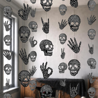 Black glitter skull and skeleton hand garland hanging for Halloween decor