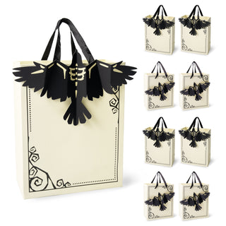 Cream paper gift bag with black handles and crow silhouette decoration