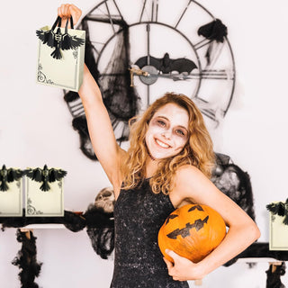 Cream Halloween gift bag with black crow applique and twisted top handles