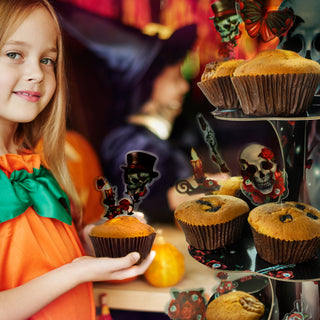 Rose skull cupcake topper set on cupcakes with Halloween skulls, roses, candles, and moths elements