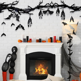 Black bat hanging banner draped across wall with silver-accented hanging bat cutouts