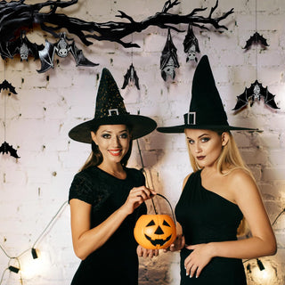 Black bat hanging banner draped across wall with multiple dangling bat silhouettes