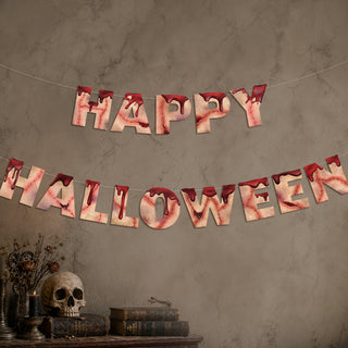 Happy Halloween fabric banner with red-and-pink stitched letter flags, strung across