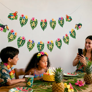 Hawaiian birthday banner with leaf pennants, toucans, flowers, and letter pieces