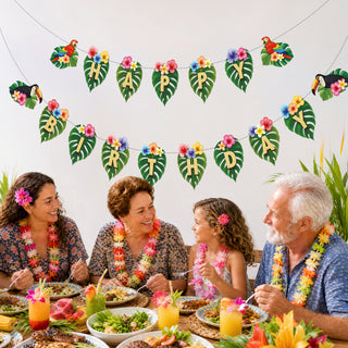 Hawaiian birthday banner with leaf pennants, toucans, and colorful flower embellishments