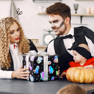 Halloween ghost gift wrap paper wrapped around a gift box with black-and-iridescent print