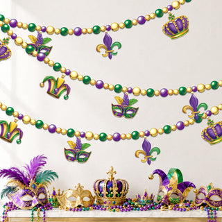 Bead garland with crown, jester mask and fleur-de-lis cutouts, decorated for parties