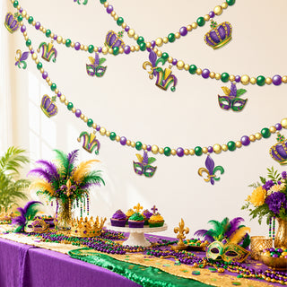 Multistrand bead banner with crown, fleur-de-lis and jester mask decorations