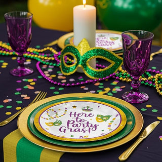 Gold-rim Mardi Gras paper plates stacked on party table, "Here to Party Gras!"