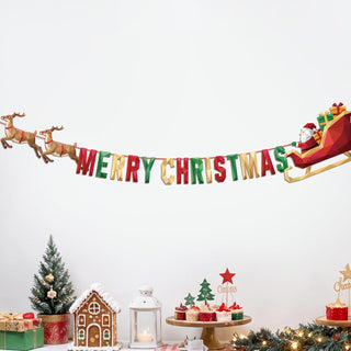 Christmas banner with “Merry Christmas” lettering, reindeer, and Santa sleigh