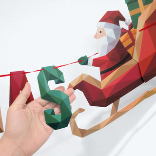 Christmas banner with Santa sleigh and reindeer, held by hand on attachment strings