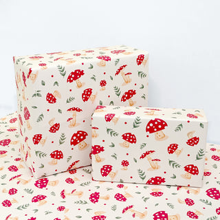 Cream gift wrap sheets with red toadstools and green leaf pattern