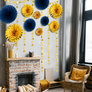 Gold and navy blue paper fan garland with hanging bead strands and round fan decorations