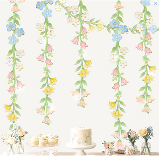 Wildflower garland with dangling blue, yellow, white, and pink blooms on green stems